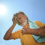 A man under the heat of the sun feeling heat exhaustion. Get relief with Mobile IV therapy services in Phoenix and Arizona. Discover element IV therapy, feel better fast with IV drip treatments near me.